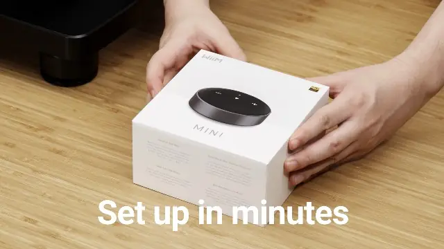WiiM Mini unboxing — 'Set up in minutes' marketing image showing a person opening the box