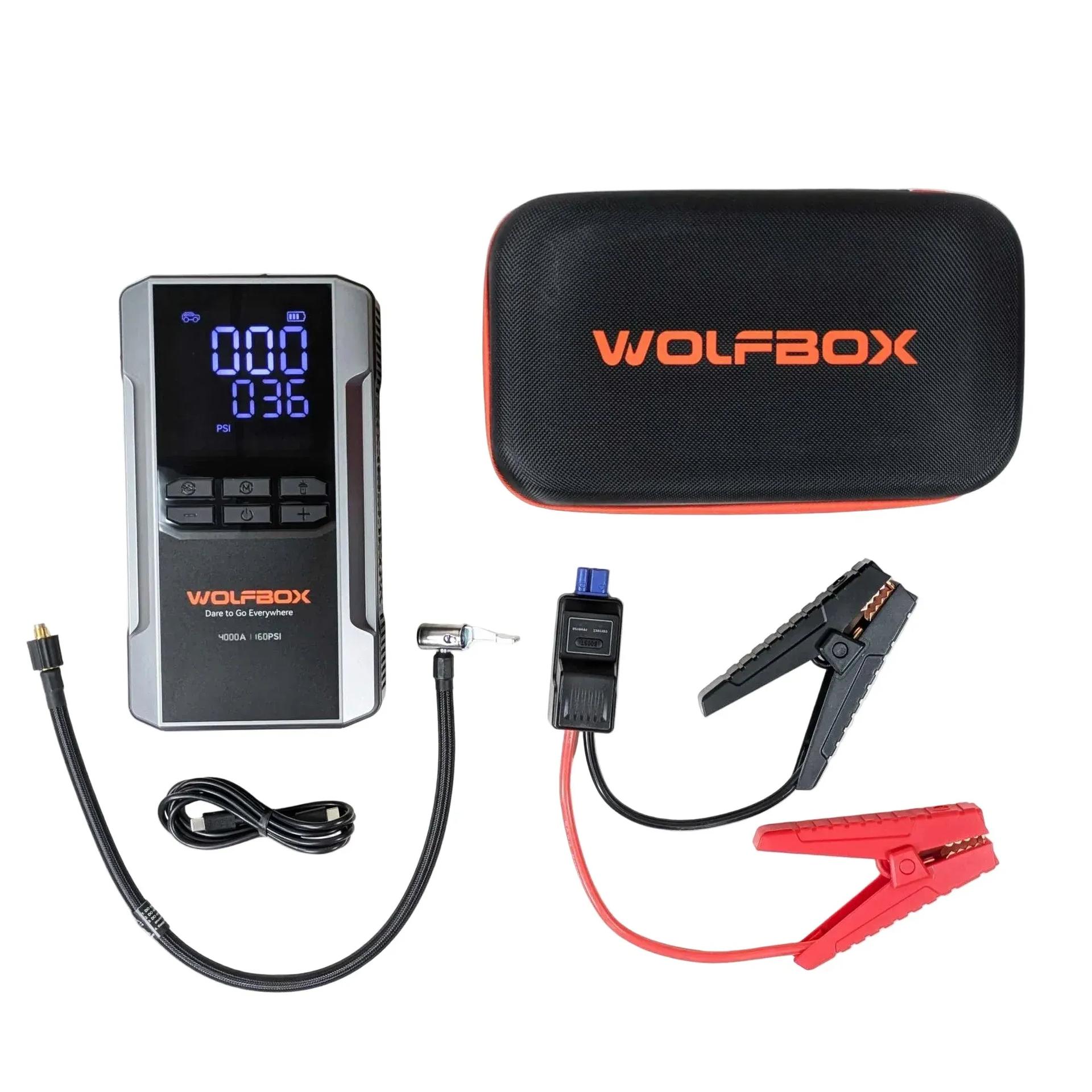 WOLFBOX 4000A jump starter connected to car battery terminals